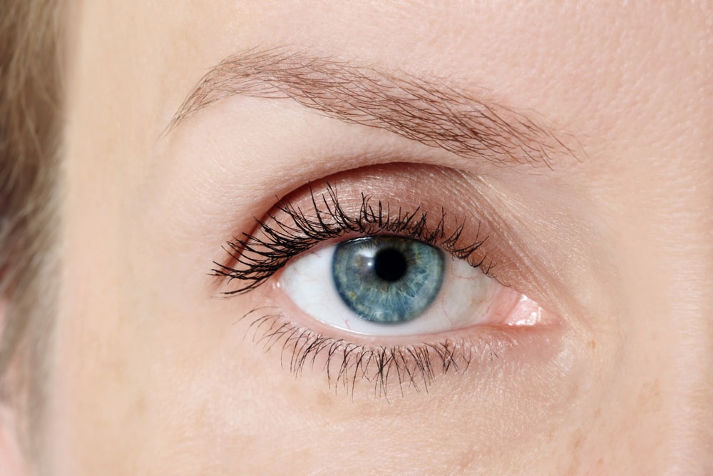 Macro shot of blue woman's eye after lasic surgery