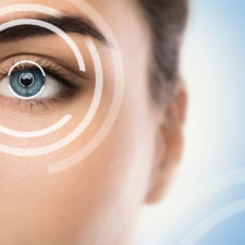 Close-up of Female Eye and Concepts of Laser Eye Surgery.
